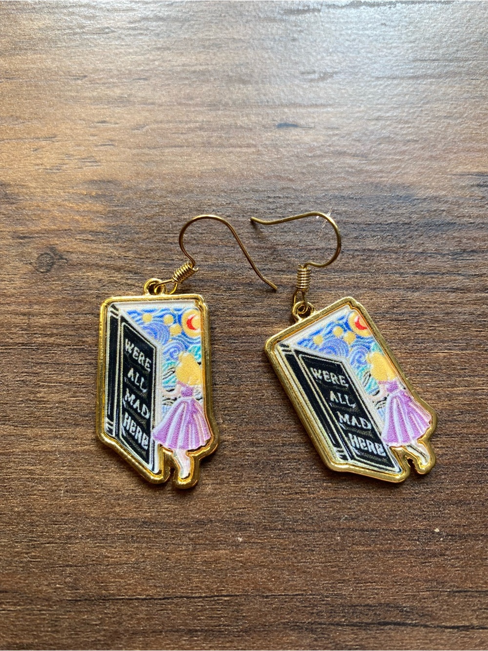 Gold Alice in Wonderland "We’re All Mad Here" Book Earrings - Pink Accent